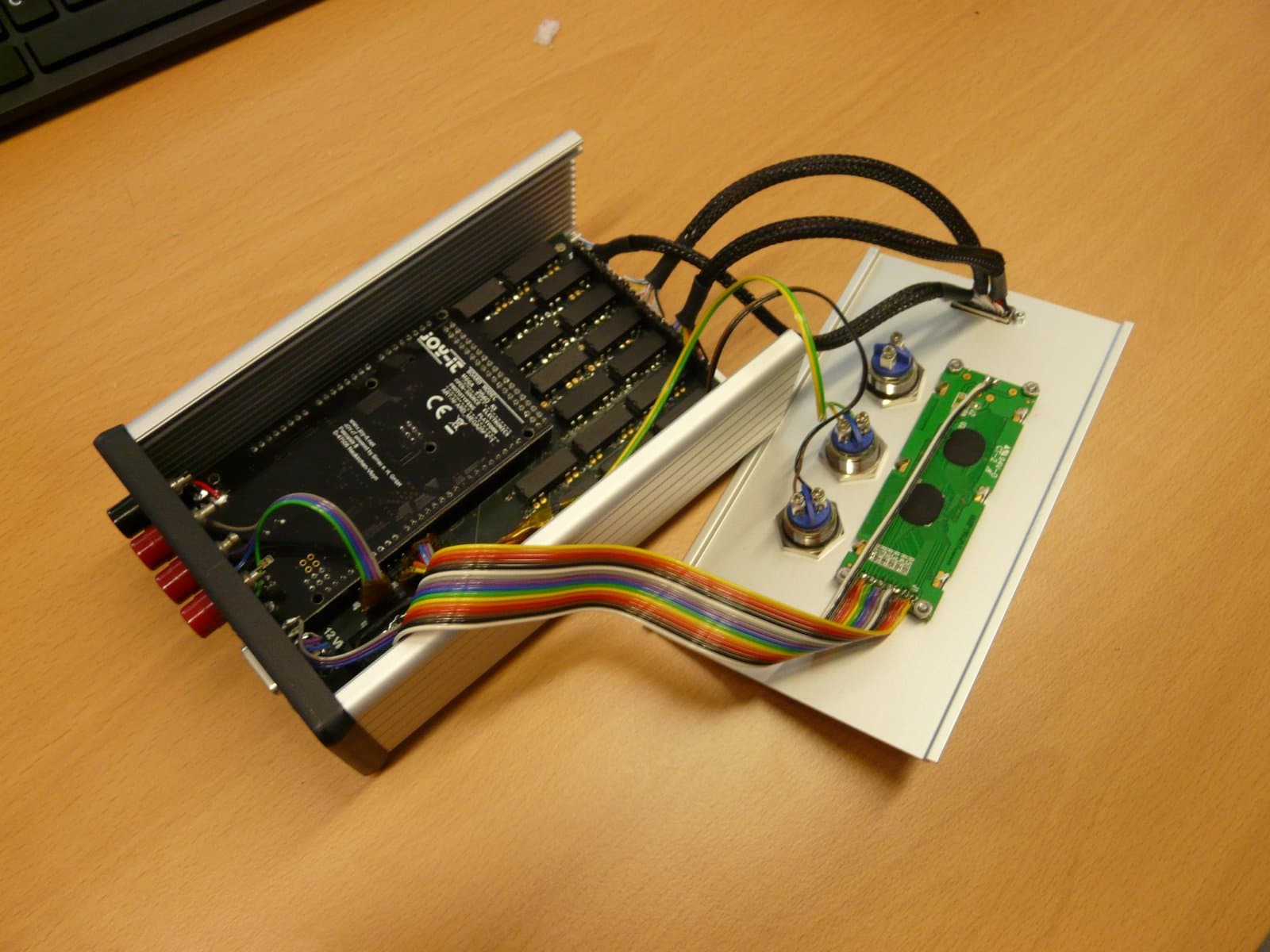 The opened test box showing the PCB with relays, Arduino and wiring to the lid